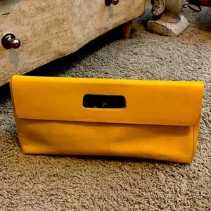 Yellow clutch-love this bag but don’t use it as much anymore so, time to sell:-)